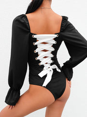 Load image into Gallery viewer, Long Sleeve Laced-up Back One-piece Bodysuit.