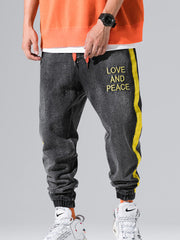 Load image into Gallery viewer, Love and Piece Print Jeans
