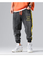 Load image into Gallery viewer, Love and Piece Print Jeans
