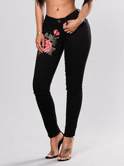 Load image into Gallery viewer, Flower Embroidered Ripped Jeans
