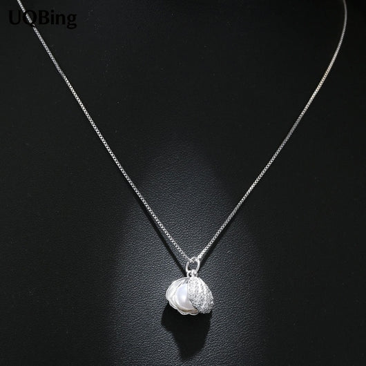 Oyster w/ Pearl Pendant and Necklace